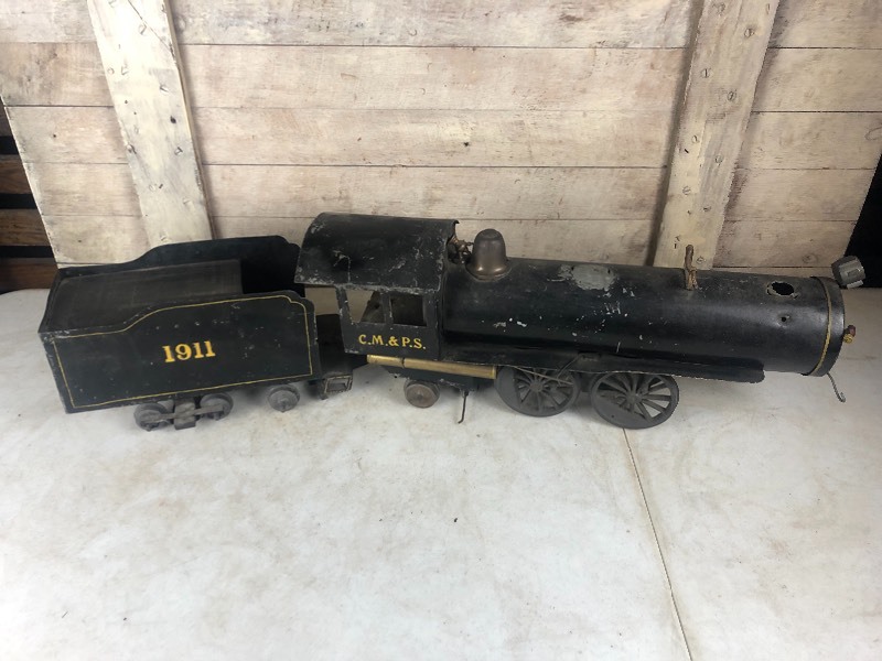 lot 303 image: Original LARGE Antique 1911 Hand Made Folk Art Metal CM&ampPS Railroad Train Toy