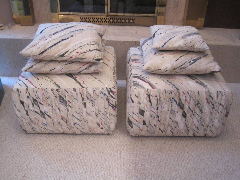 lot 11 image: A pair of Ottomans with matching Pillows in a Jackson Pollack style.