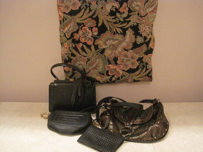lot 24 image: A lot of 4 hand bags and 1 Garment Bag, 5 Total.