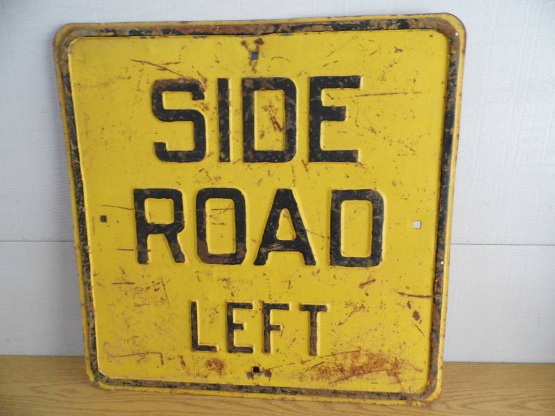 Side Road Left Sign
