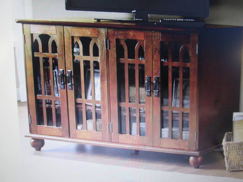 lot 64 image: Arched-Door Mission Style 4-Door TV...