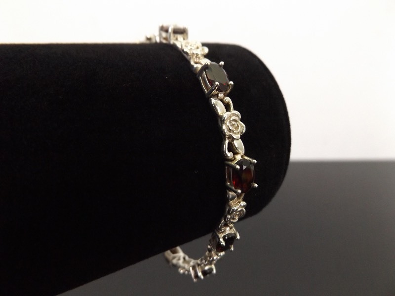 lot 27 image: .925 Sterling Silver Faceted Garnet Bracelet