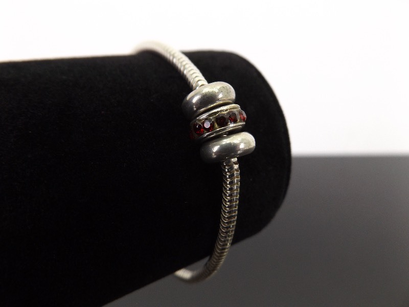 lot 28 image: .925 Sterling Silver Charm Bracelet with 3 Charms