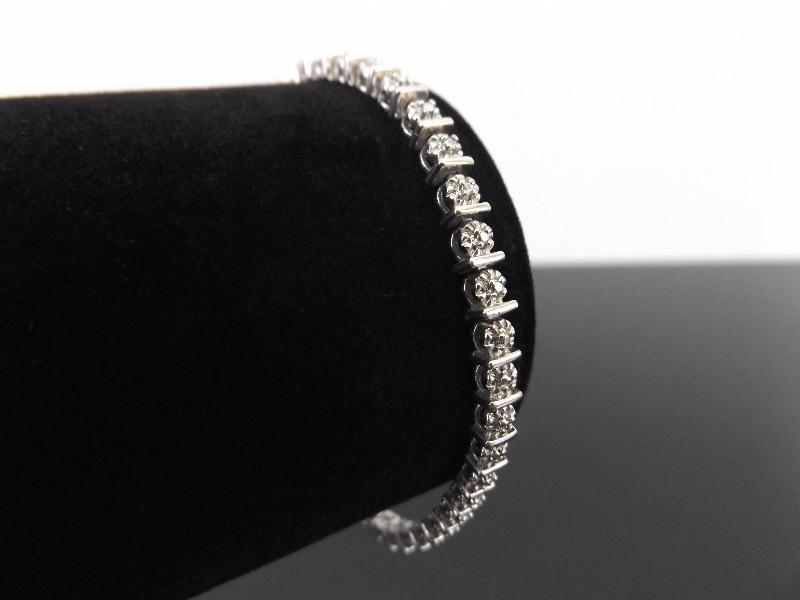 lot 37 image: .925 Sterling Silver Diamond Accented Bracelet