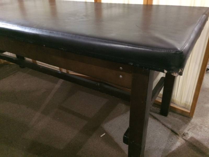 EXAM TABLE - HAS SOME WEAR TO VINYL BUT REMOVE THE CUSHIONED PAD &amp ADD A BOARD ON TOP THESE TABLES MAKE AMAZING WORKSHOP TABLES - UP TO 800LB CAPACITY