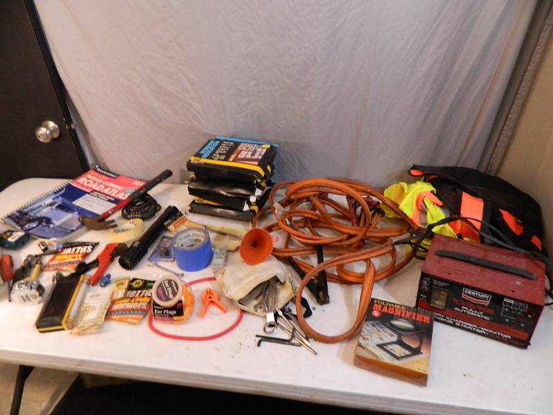 lot 202 image: Battery Charger, Jumper Cables, Road Atlas, Tools, Etc.