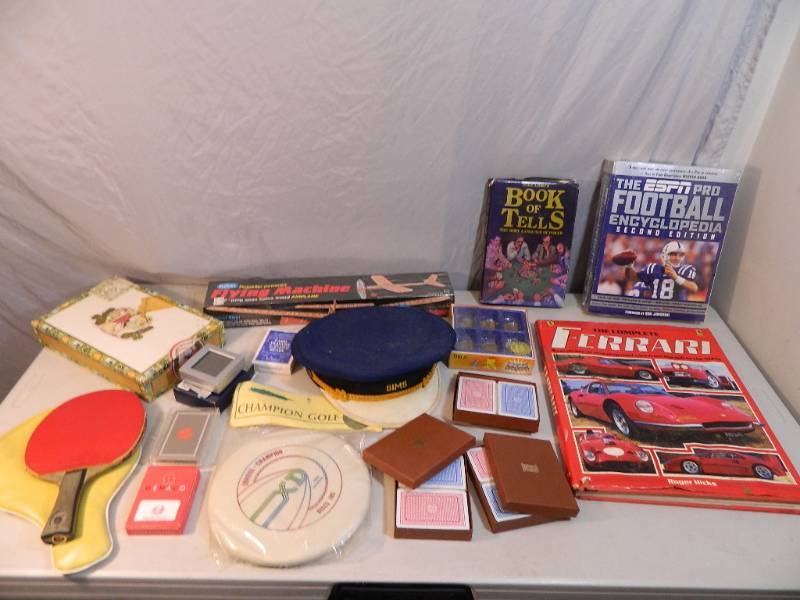 lot 81 image: Brookstone Travel Clock and Assorted Collectibles
