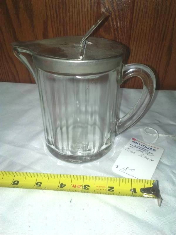 lot 13 image: Glass  metal cream or milk pitcher