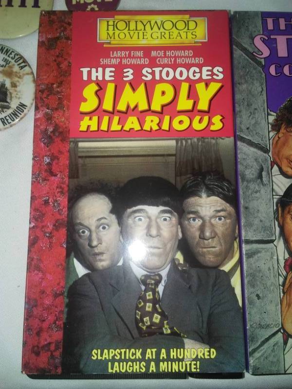 lot 165 image: Buttons Pins 3 Stooges, Yakov, VHS.