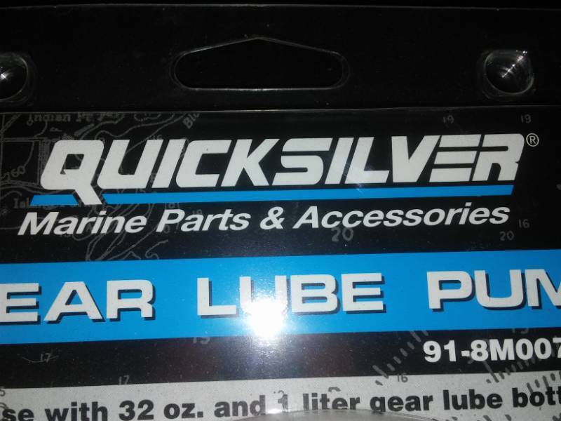 lot 467 image: OMC 3 gallon gas tank and Quicksilver gear lube pump.
