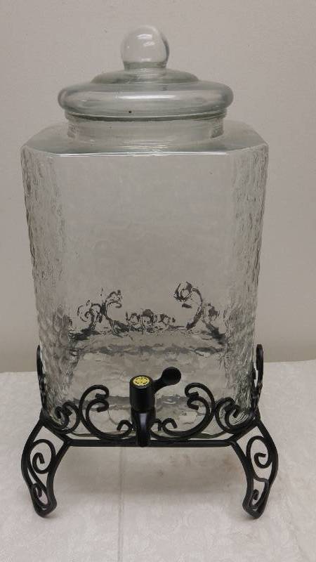 lot 534 image: Glass Beverage Dispenser with ornate metal base