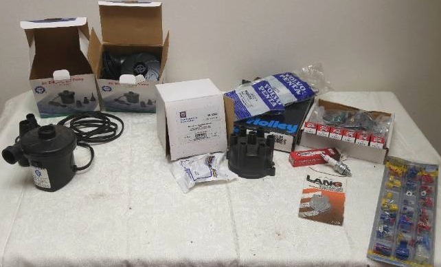 lot 551 image: Electric Air Pumps (new and used), and distributer cap and rotor (used)