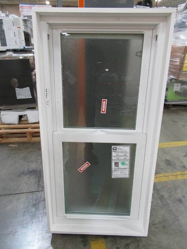 lot 159 image: Custom Vinyl Double Hung Window in White With Full Screen, Iced Glass and Tilting Sashes, 23 12 X 47 14 X 4 916