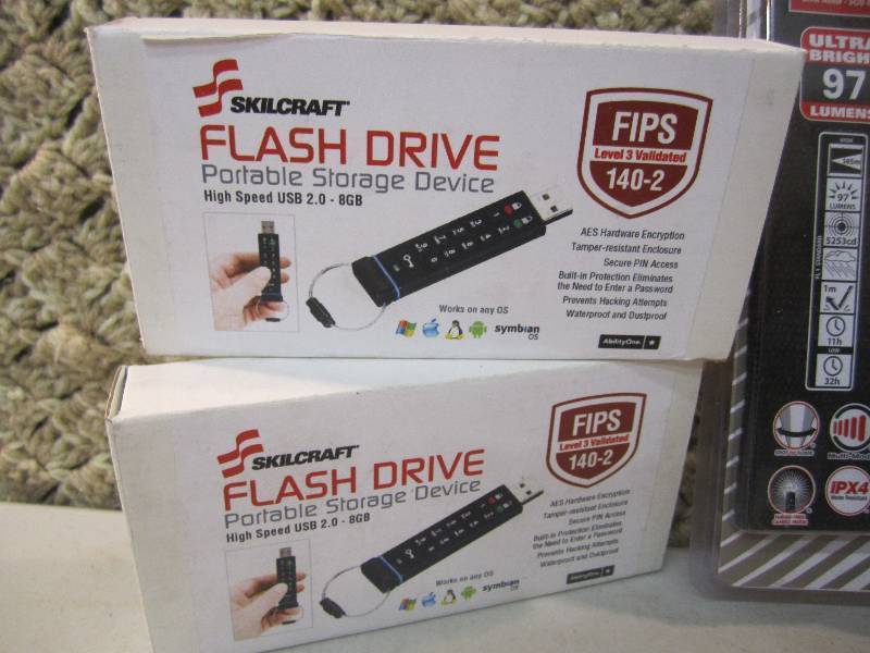 lot 91 image: Lot of 2 Flash Drives and an LED Mi...