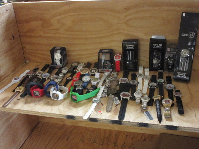 lot 204 image: A COLLECTION OF 50 SPORT TEAM WATCHES