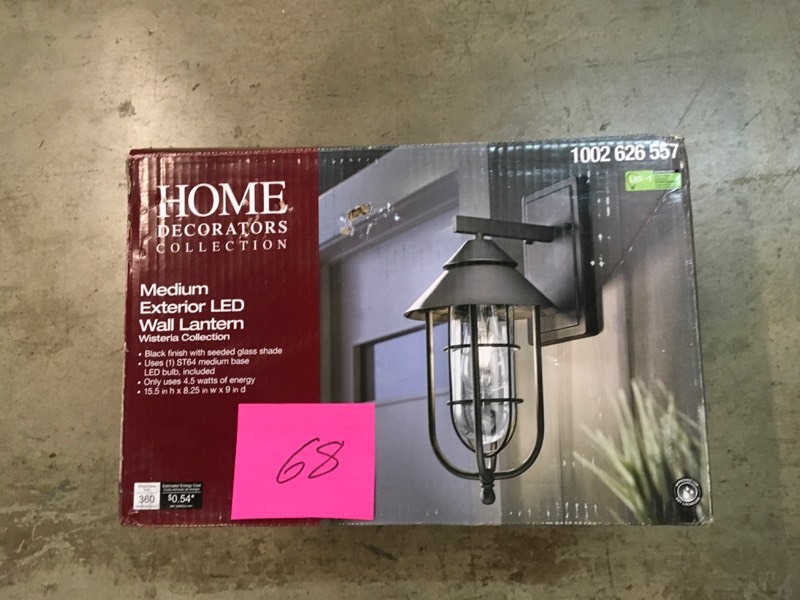 lot 68 image: Home Decorators Collection Wisteria Collection 1-Light Sand Black Outdoor Wall Lantern Sconce with Clear Glass Shade- not used