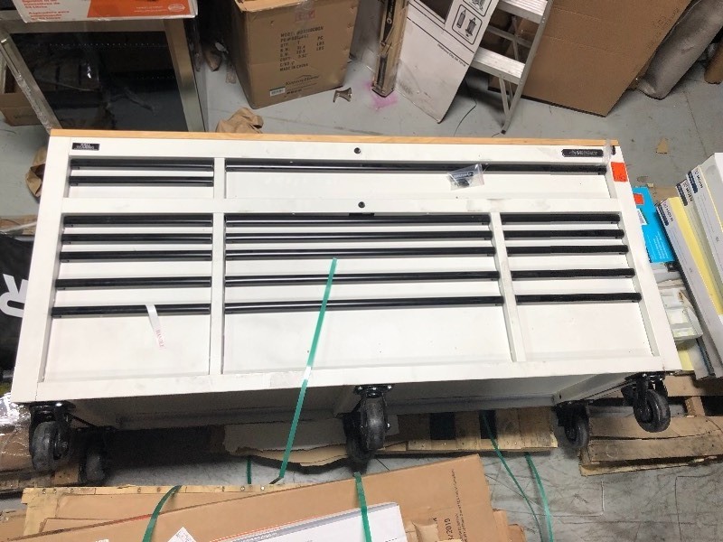 lot 161 image: Husky 72 in. 18-Drawer Mobile Workbench with Adjustable-Height Solid Wood Top in Matte White whits some scratch and dents stock photo used to display the unit