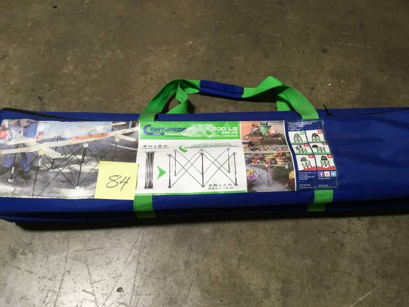 lot 84 image: CENTIPEDE PORTABLE WORK SYSTEM 30.5 IN. COMPACTING 2 FT. X 4 FT. SAWHORSE- not used