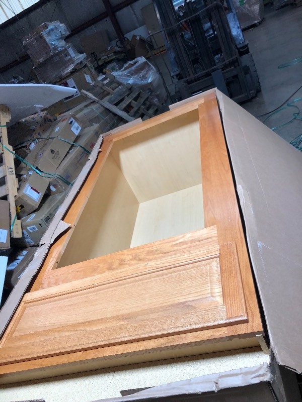 lot 153 image: Hampton Bay Hampton Assembled 33x90x24 in. Double Oven Kitchen Cabinet in Medium Oak not used