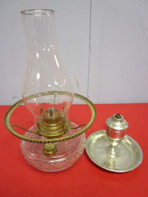 lot 324 image: SHIRLEY PEWTER OIL CANDLEHOLDER AND A GLASS OIL LAMP