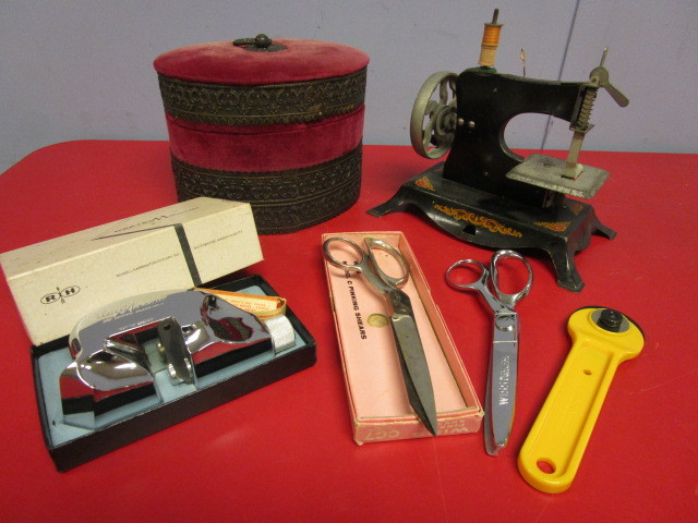 lot 332 image: LITTLE MISS SEWING MACHINE BY LINDSTROM TOYS, OTHER VINTAGE SEWING ITEMS, AND MAT CUTTER