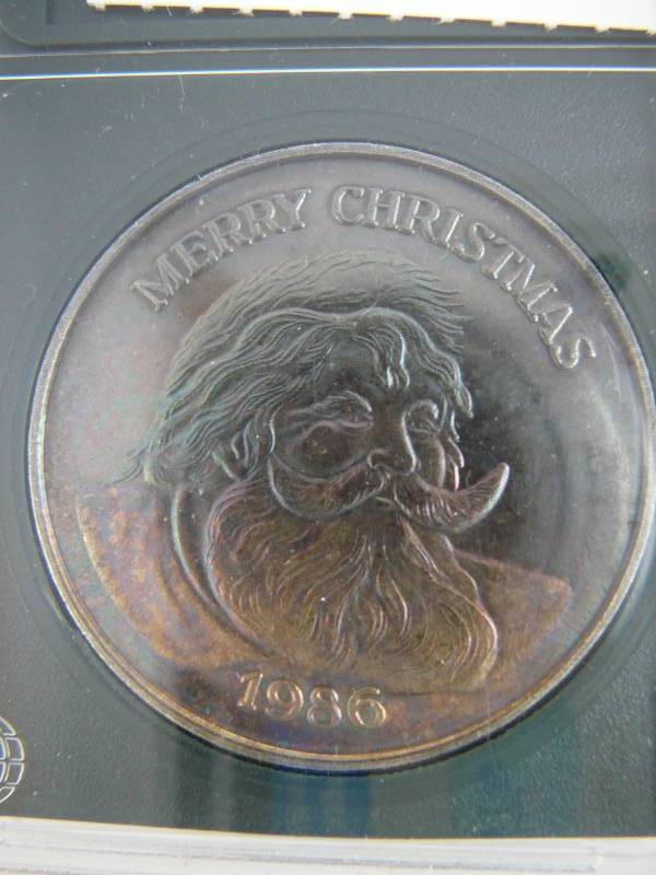 lot 48 image: 1986 .999 Fine Silver 1 Troy Ounce Merry Christmas