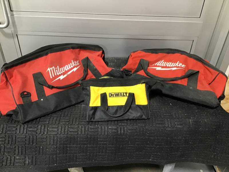 lot 39 image: Milwaukee Two Large Duffel Bags, DeWalt Tool Bag- All 3 bags in Well-Used condition.