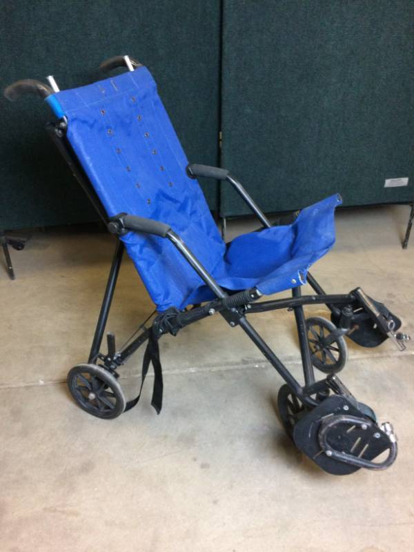 lot 39 image: MSRP $1600&nbspConvaid Cruiser Classic Positioning Wheelchair is a lightweight and compact folding wheelchair - Great Condition - May Be Missing Some Straps That Can be purchased online