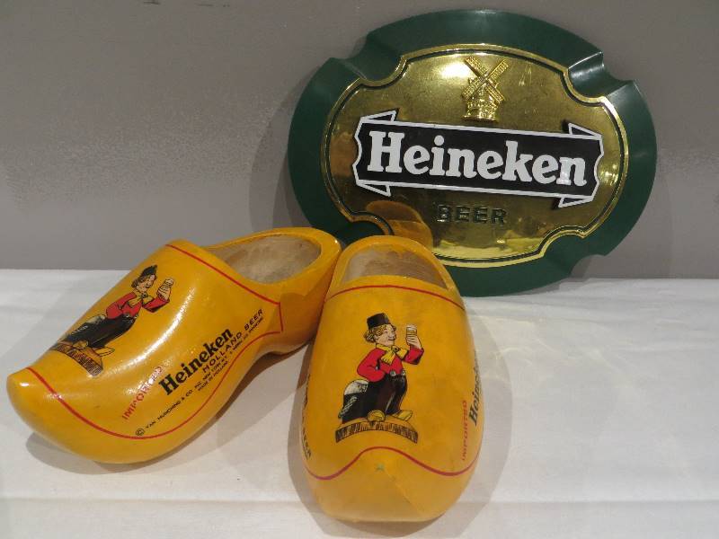 lot 43 image: Small plastic Heineken beer sign & pair of wooden Heineken clogs