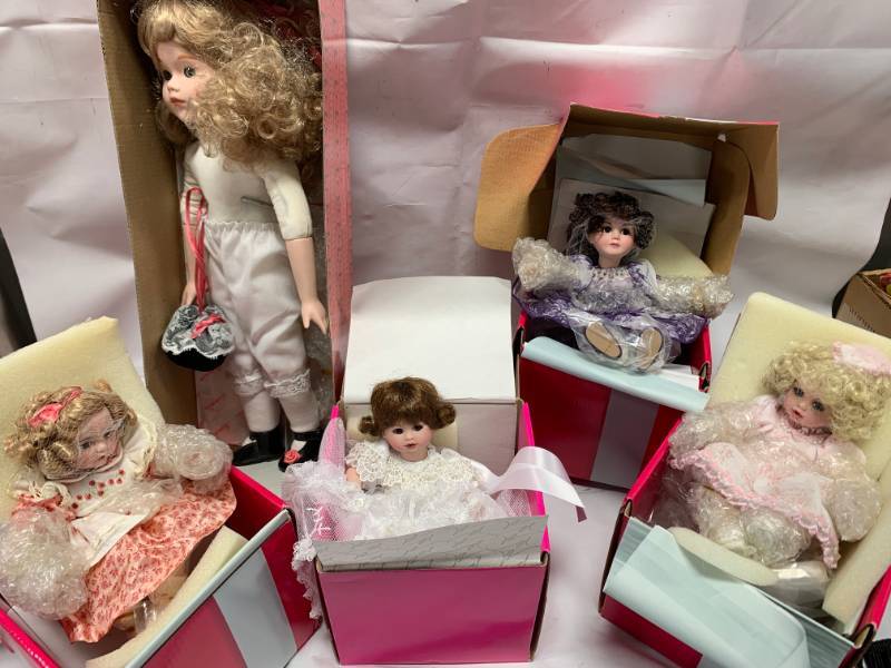 lot 53 image: Lot of 4 Marie Osmond Porcelain Dolls $240 retail
