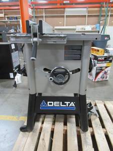 lot 403 image: Delta 15 Amp 10 in. Left Tilt 52 in. Contractor Table Saw with Steel Wings - Does Not Run, Blade Wheel Damaged.