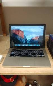 lot 1 image: Mac Book Pro With Charger WORKS