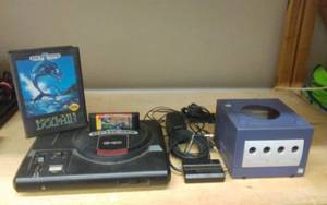 lot 5 image: Sega Genesis With Power & AV Cords, 2-Games & Ninetendo Game Cube With AV Cord Only