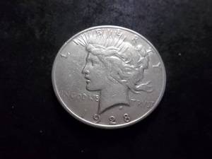 lot 55 image: 1928 S Silver Peace Dollar
