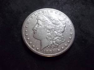 lot 12 image: 1884 CC Morgan Silver Dollar