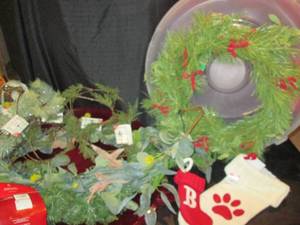 lot 56 image: Wreath Storage Container, Wreath, 2 Garland (6 & 9), Holiday Stockings 11