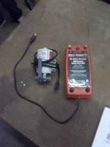 lot 173 image: Teel Transfer Pump & Water Filter, Red Snap-R Electric Fence Controller