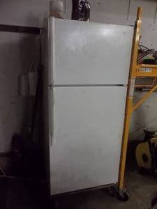lot 194 image: Roper Model RT14BKXJW00 RefrigeratorFreezer (No Contents) Includes 4-Wheel Dolly