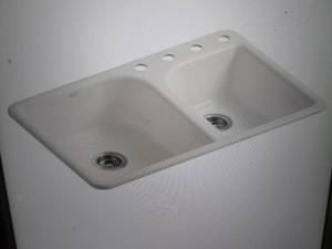 lot 9 image: Kohler Efficiency Drop-In Cast Iron...