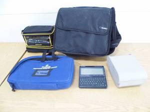 lot 19 image: Cases - Franklin Language Machine