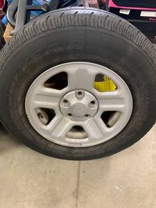 lot 32 image: Goodyear Wrangler Tire P225  75  R16  Just taken off my personal Jeep