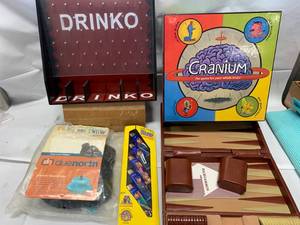 lot 58 image: Drinko, Ice Shoe Cleats, Lighter, Cranium Game, Backgammon