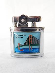 lot 61 image: Vintage Penguin Mackinac Bridge Lighter