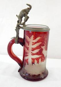 lot 146 image: Vintage Ruby Red Etched Ram Beer Stein