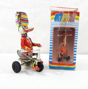 lot 200 image: Vintage Duck on a Bike Tin Toy