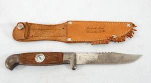 lot 19 image: Vintage Wisconsin Dells Storybook Land Hunting Knife With Leather Sheath