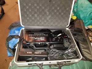 lot 134 image: Panasonic Omni Movie VHS HQ Video Camera PV-602, Manfrotto Bogen Camera Stand 3406, Hard -Side Camera Case, Accessories