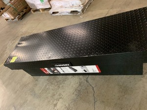 lot 11 image: HUSKY 71.36 Matte Black Aluminum Full Size Crossbed Truck Tool Box- Has keys but will not open because of dent