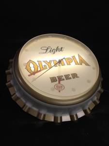 lot 80 image: Olympia bottle cap light up wall clock
