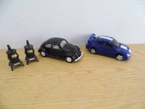 lot 85 image: Black Metal VW Beetle - Plastic Beetle